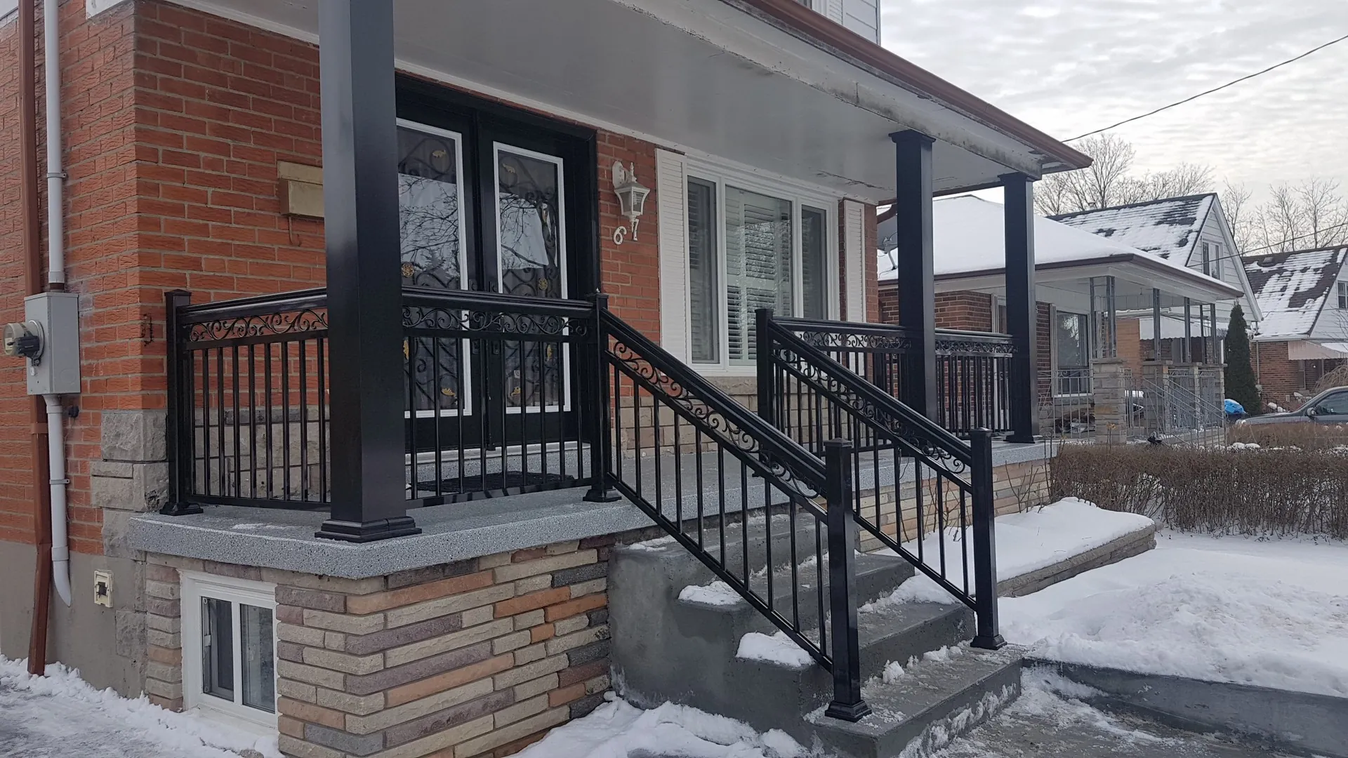 After: black aluminum picket porch railing Oakville installation